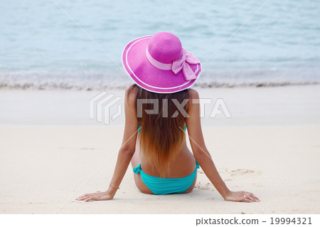 Woman on tropical beach Woman on tropical beach 19994321