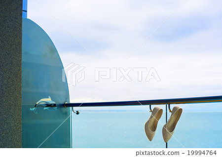 Bridal shoes on the fencing. 19994764