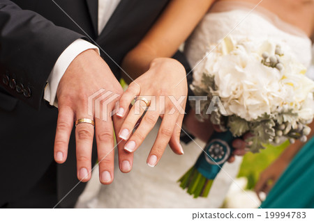 Newlyweds hands. 19994783