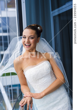 Bride near the glass wall. Bride near the glass wall. 19994855