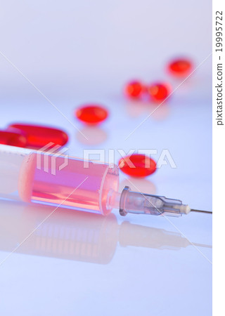 Red liquid and solid medicines on the surface. Red liquid and solid medicines on the surface. 19995722