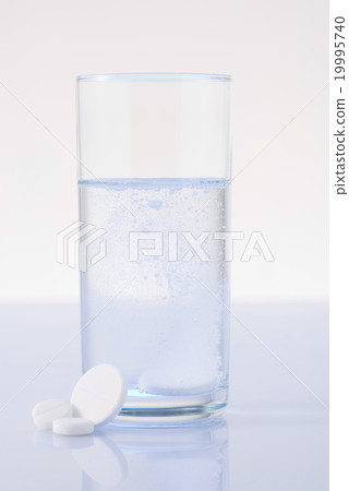 Glass of water mixed with pill. Glass of water mixed with pill. 19995740