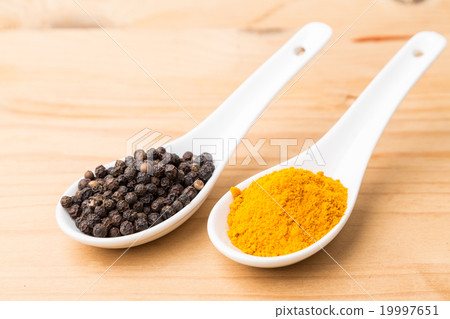 Turmeric roots and black pepper combination Turmeric roots and black pepper combination 19997651