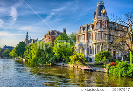 Amstel river with beautiful houses in Amsterdam Amstel river with beautiful houses in Amsterdam 19997947