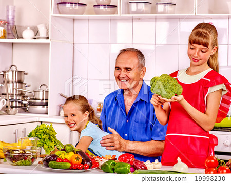 Grandfather  with kids cooking at kitchen. 19998230