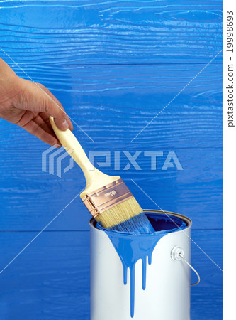 hand holding Paint brush in blue color oil paint hand holding Paint brush in blue color oil paint 19998693