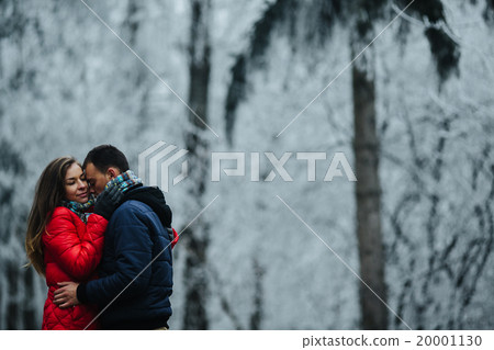 couple walking on a winter park 20001130