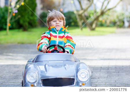 Little preschool boy driving big toy old vintage Little preschool boy driving big toy old vintage 20001776