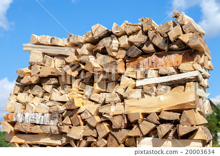 Chopped and stacked up dry firewood  20003634