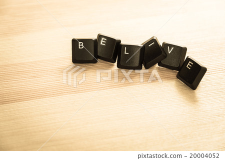 Belive word keyboard on wooden floor retro style 20004052