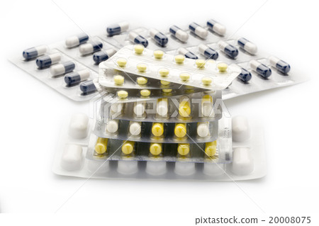 Heap blister packs of colorful pills and capsules 20008075
