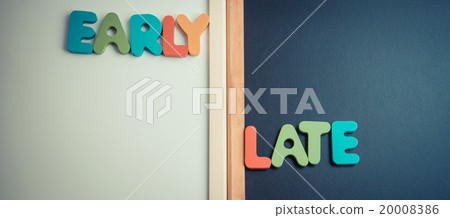 Wooden word EARLY and LATE on black board 20008386