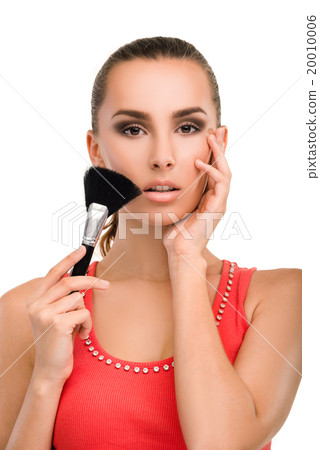 Make-up artist applying blusher. Make-up artist applying blusher. 20010006