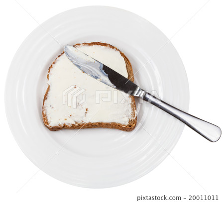 above view of knife on bread with spread on plate above view of knife on bread with spread on plate 20011011