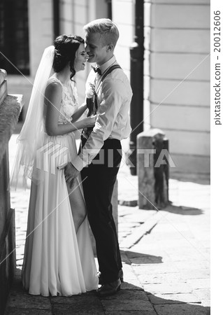 The bride and groom posing  20012606