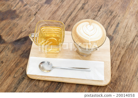 Cup of coffee latte art on wood table Cup of coffee latte art on wood table 20014058