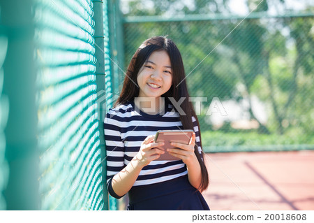 girl and computer tablet in hand  20018608