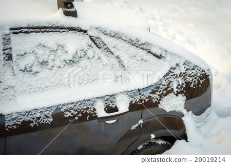Snow covered car after snowfall Snow covered car after snowfall 20019214