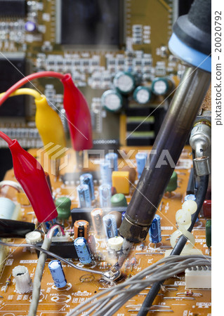 Soldering iron working on electronic boards Soldering iron working on electronic boards 20020792
