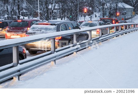Cars in a traffic jam on winter street Cars in a traffic jam on winter street 20021096
