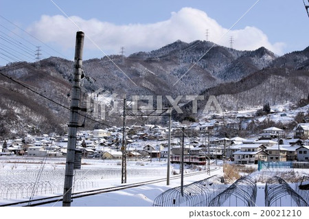 Country landscape with a train running through Shinshu in early winter Country landscape with a train running through Shinshu in early winter 20021210