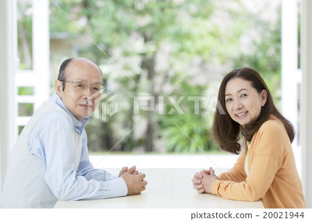 Senior couple heading to the table 20021944