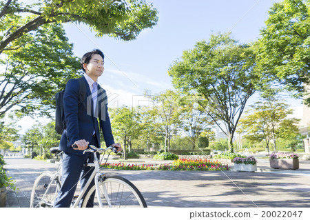 A businessman riding a bicycle 20022047