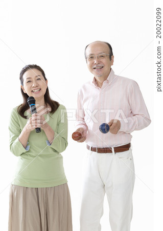 Senior couple with microphone and maracas Senior couple with microphone and maracas 20022099