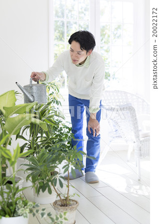 Men in their 20s watering 20022172