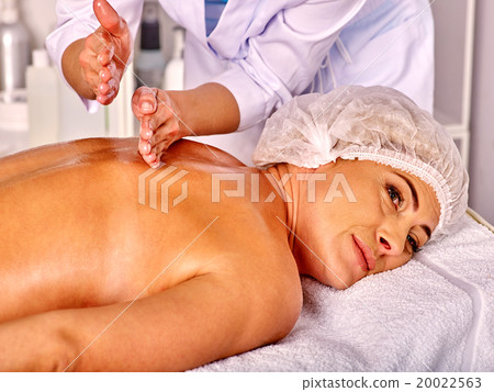 Stock Photo: Woman middle-aged in spa salon with beautician.