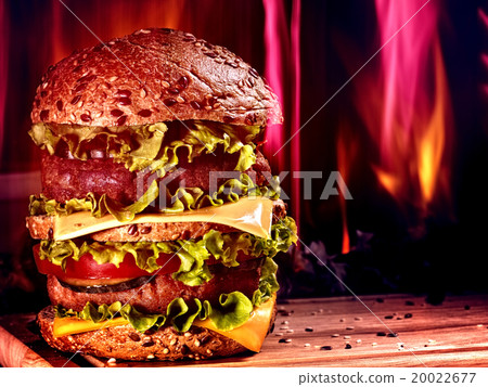 Hamburger with ham on wooden board . 20022677