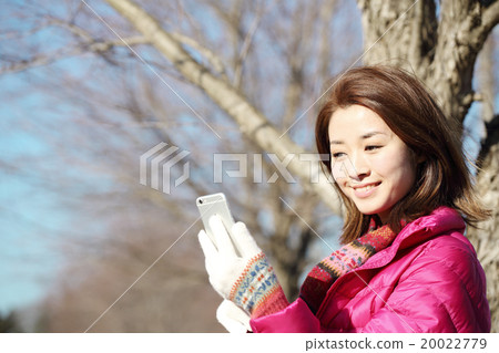 A woman in a coat A woman in a coat 20022779