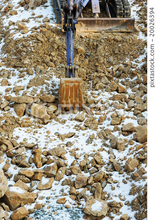 Small bulldozer excavator at construction site. 20026394