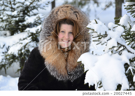 Positive middle-aged woman in fur coat at winter Positive middle-aged woman in fur coat at winter 20027445