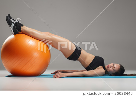 The young, beautiful, sports girl doing exercises 20028443