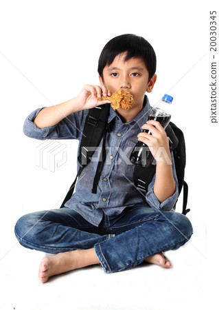Kid eating Fried chicken Kid eating Fried chicken 20030345