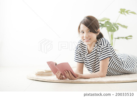 Woman relaxing in room (reading casual 20's) Woman relaxing in room (reading casual 20's) 20033510