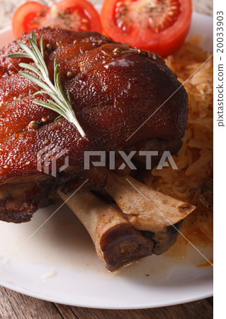 baked pork shank and sauerkraut on a plate 20033903