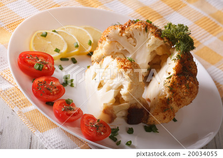 cut cauliflower baked with cheese close-up cut cauliflower baked with cheese close-up 20034055