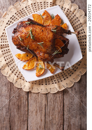 Delicious Roast duck with oranges on a plate Delicious Roast duck with oranges on a plate 20034772