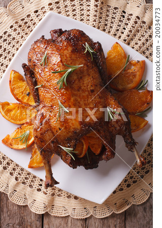 Delicious Roast duck with oranges closeup Delicious Roast duck with oranges closeup 20034773