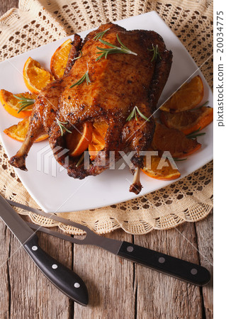 Delicious roast duck with oranges and rosemary Delicious roast duck with oranges and rosemary 20034775