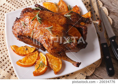 whole baked duck with oranges and rosemary whole baked duck with oranges and rosemary 20034776