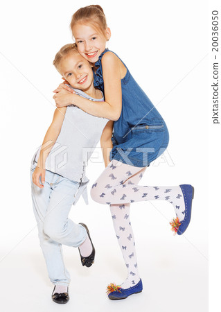 Two beautiful girls hugging 20036050