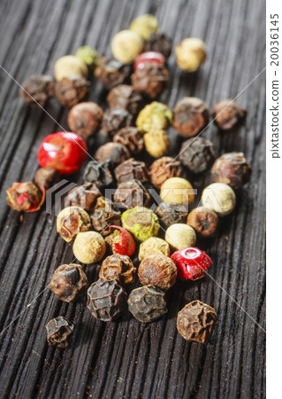 pepper corns on a wooden board pepper corns on a wooden board 20036145