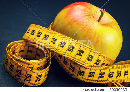 apple with yellow measuring tape 20036985