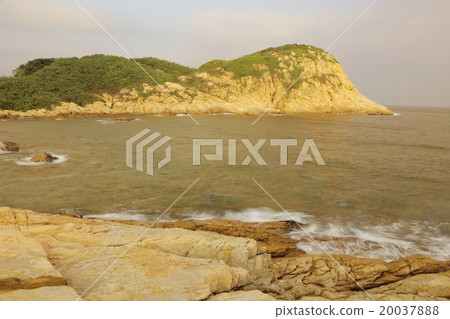 rocky sea coast and blurred water in shek o, 20037888