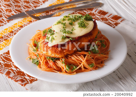 Chicken Parmigiana and pasta with tomatoes closeup 20040992