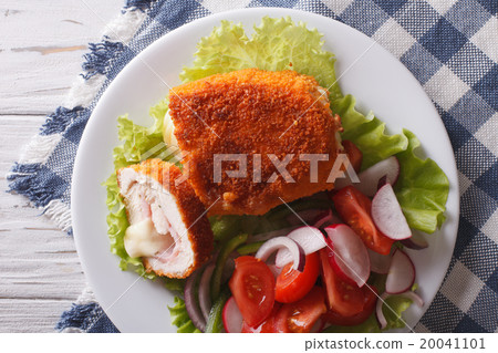 Chicken schnitzel cordon bleu and a salad close-up 20041101