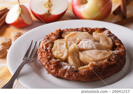 Dutch baby pancake with apples on a plate Dutch baby pancake with apples on a plate 20041257